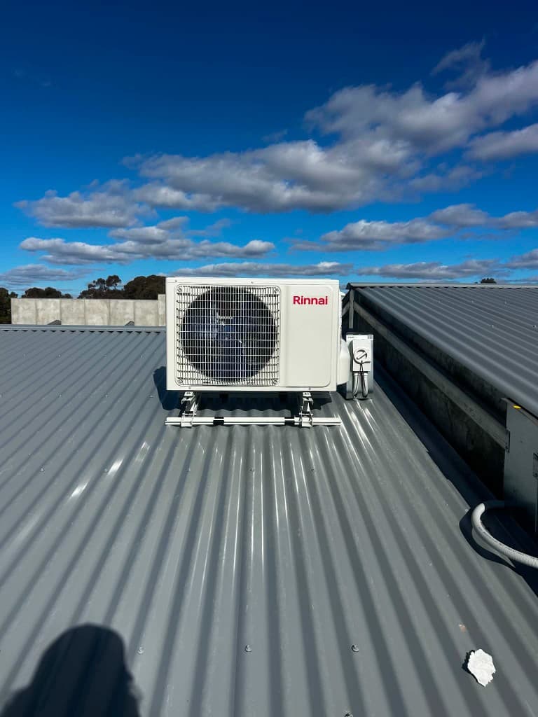 Split-system outdoor unit installed on a corrugated roof